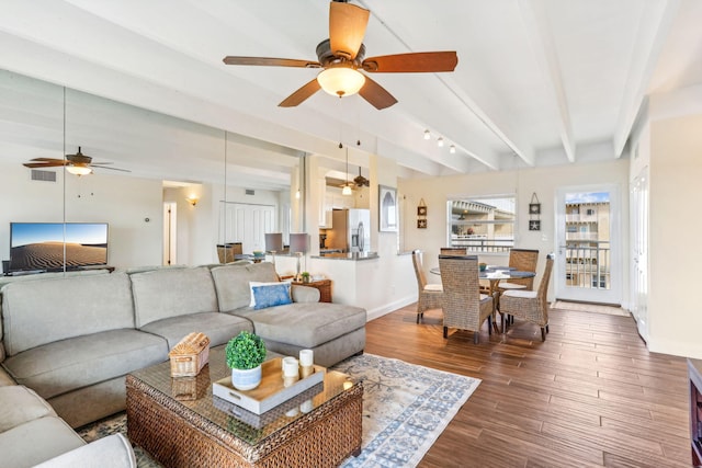 living room featuring beam ceiling