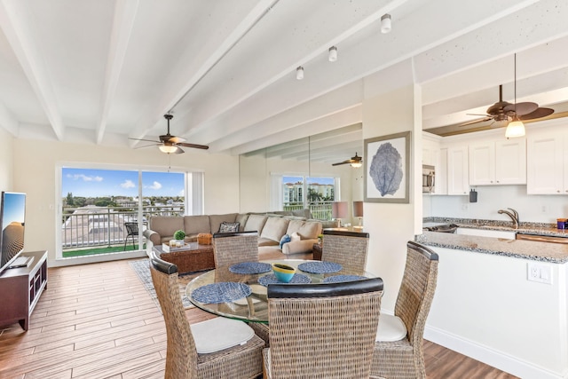 dining room with beamed ceiling