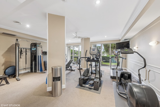 exercise area with light colored carpet, ceiling fan, and ornamental molding