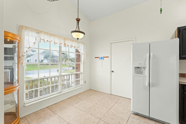 unfurnished dining area with light tile patterned flooring