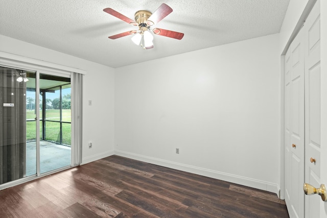 unfurnished bedroom featuring a textured ceiling, dark hardwood / wood-style flooring, access to outside, and ceiling fan