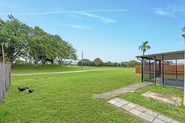 view of yard featuring a sunroom