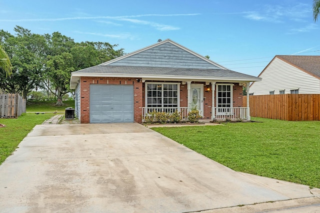 view of front of house with a porch, central AC unit, a front yard, and a garage