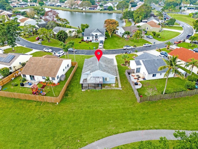 birds eye view of property featuring a water view