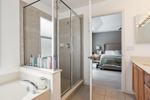 bathroom featuring vanity, tile patterned flooring, and independent shower and bath