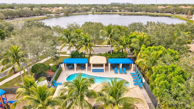 view of swimming pool featuring a patio area and a water view