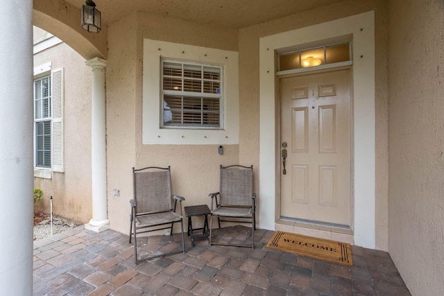 property entrance featuring a patio