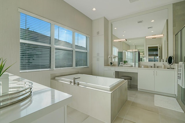 bathroom featuring vanity, tile patterned flooring, and independent shower and bath