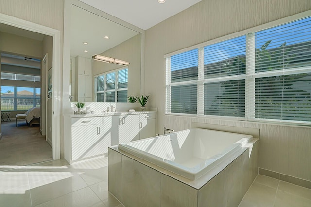 bathroom with vanity, shower with separate bathtub, and tile patterned flooring