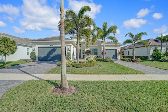 ranch-style house with a front yard and a garage