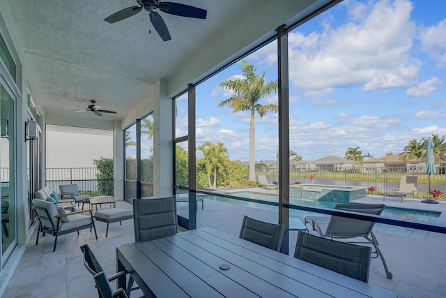 sunroom / solarium with ceiling fan