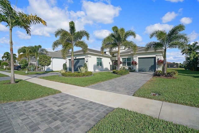 ranch-style home featuring a front yard and a garage