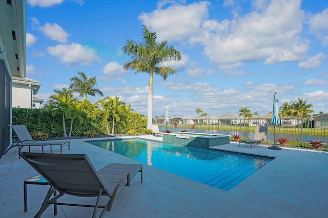 view of pool with an in ground hot tub and a patio area