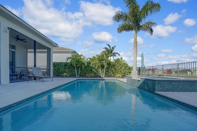 view of pool with a patio area, ceiling fan, and an in ground hot tub