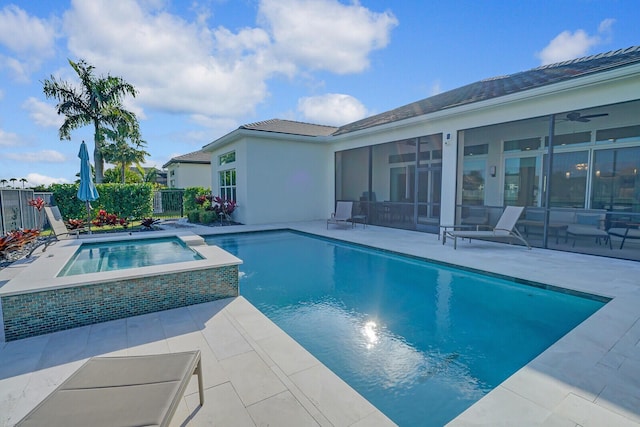 view of pool with a sunroom, a patio area, and an in ground hot tub