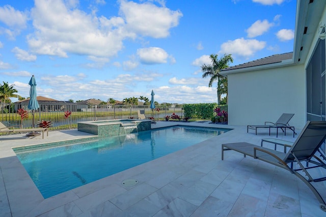 view of pool featuring a patio and an in ground hot tub