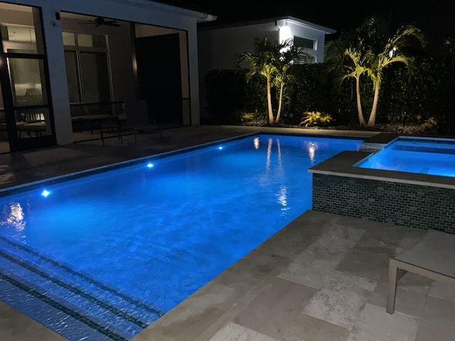 view of pool featuring ceiling fan, a patio, and an in ground hot tub