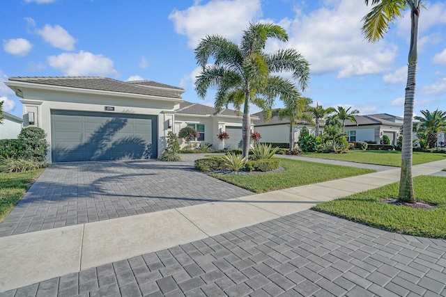 single story home with a front lawn and a garage