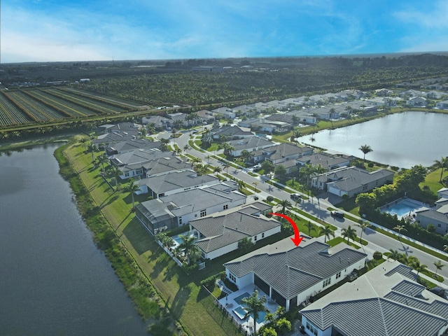 birds eye view of property featuring a water view