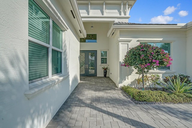 property entrance featuring french doors