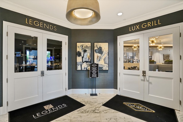 entryway with french doors and ornamental molding