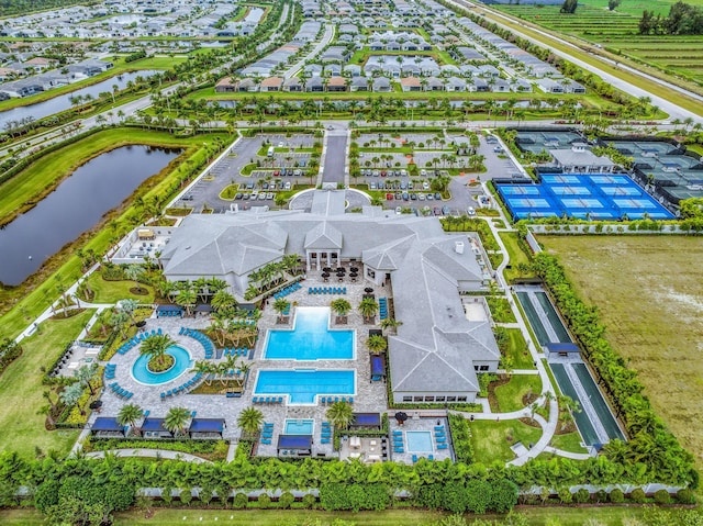 birds eye view of property featuring a water view