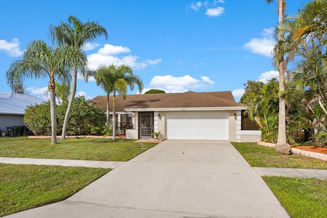 view of front of property featuring a garage and a front lawn