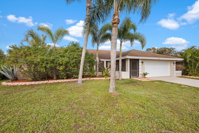 view of front of home featuring a garage and a front yard