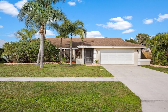 view of front of house with a front lawn and a garage