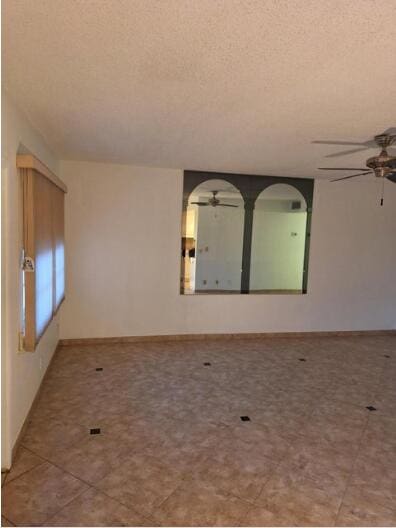 spare room with a textured ceiling