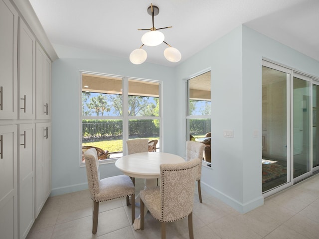 dining space with light tile patterned floors