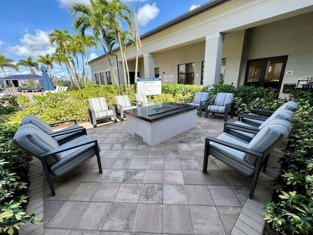 view of patio / terrace with an outdoor fire pit