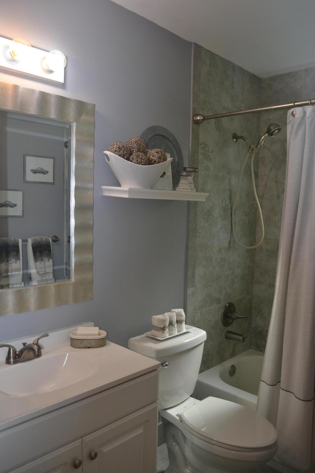 full bathroom with toilet, vanity, and shower / bath combo with shower curtain