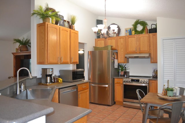 kitchen featuring decorative light fixtures, sink, an inviting chandelier, appliances with stainless steel finishes, and light tile patterned floors