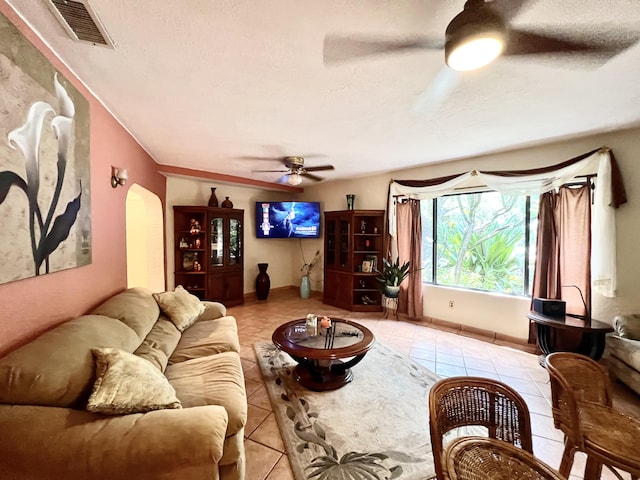 tiled living room with a textured ceiling