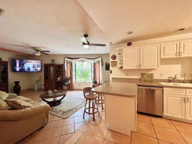 living room with ceiling fan and light tile patterned floors