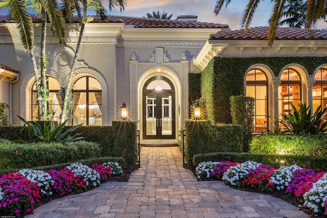 exterior entry at dusk with french doors