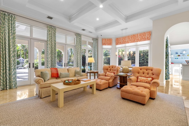 sunroom with beamed ceiling, french doors, and coffered ceiling