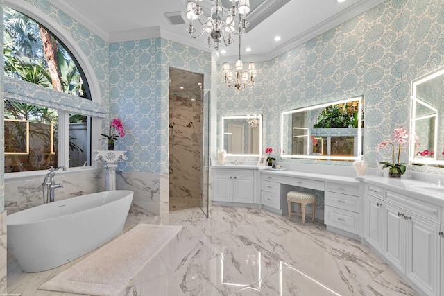 bathroom with vanity, ornamental molding, shower with separate bathtub, and an inviting chandelier