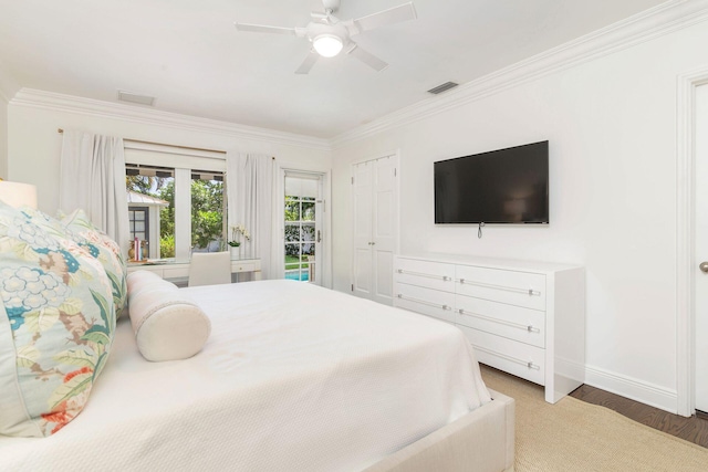 bedroom with ceiling fan, dark wood-type flooring, and crown molding