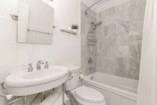 full bathroom with toilet, decorative backsplash, tile walls, shower / tub combo, and sink