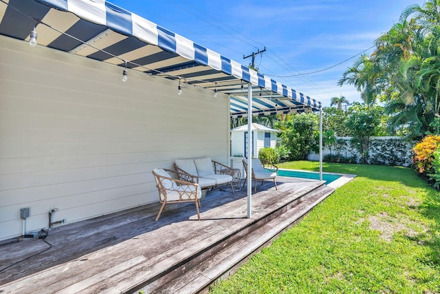 wooden terrace with a yard