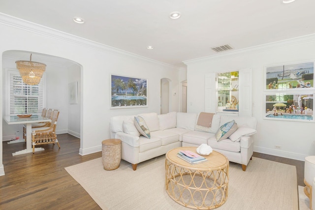 living room featuring ornamental molding and hardwood / wood-style flooring