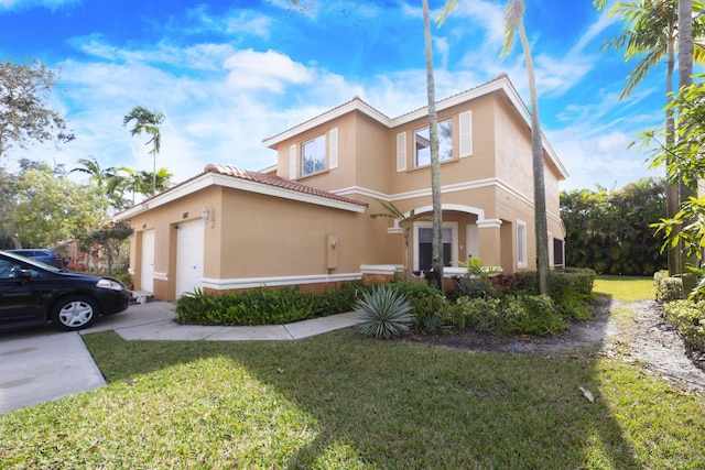 view of front of property with a front lawn and a garage