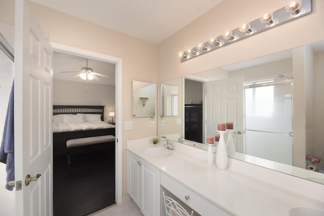 bathroom with ceiling fan, vanity, and tile patterned floors