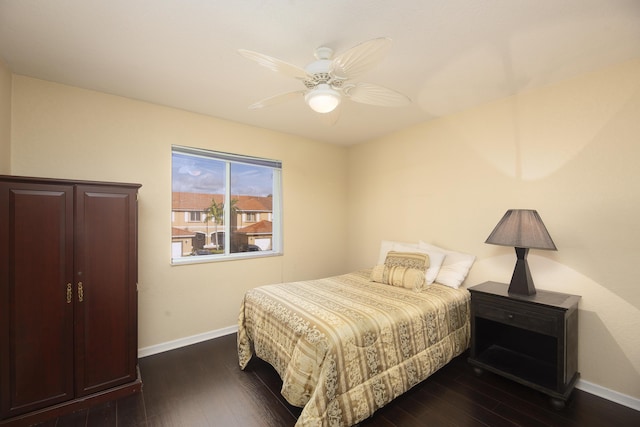 bedroom featuring ceiling fan and dark hardwood / wood-style floors