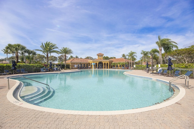 view of swimming pool with a patio