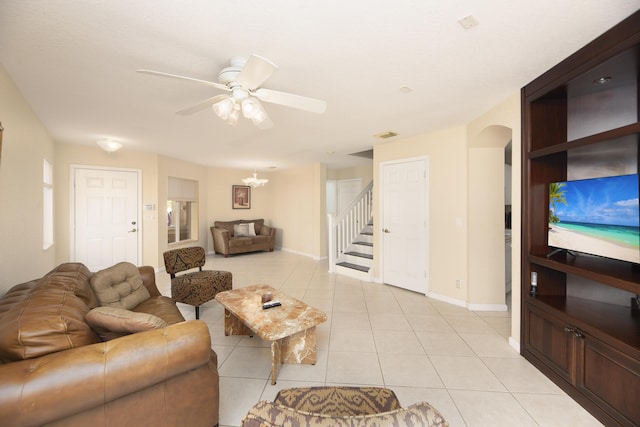 living room with ceiling fan and light tile patterned floors