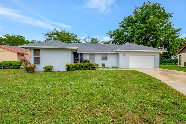 single story home with a garage and a front yard