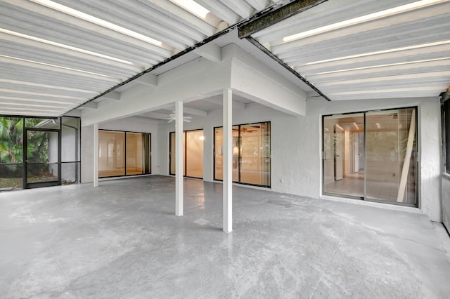 unfurnished sunroom featuring lofted ceiling